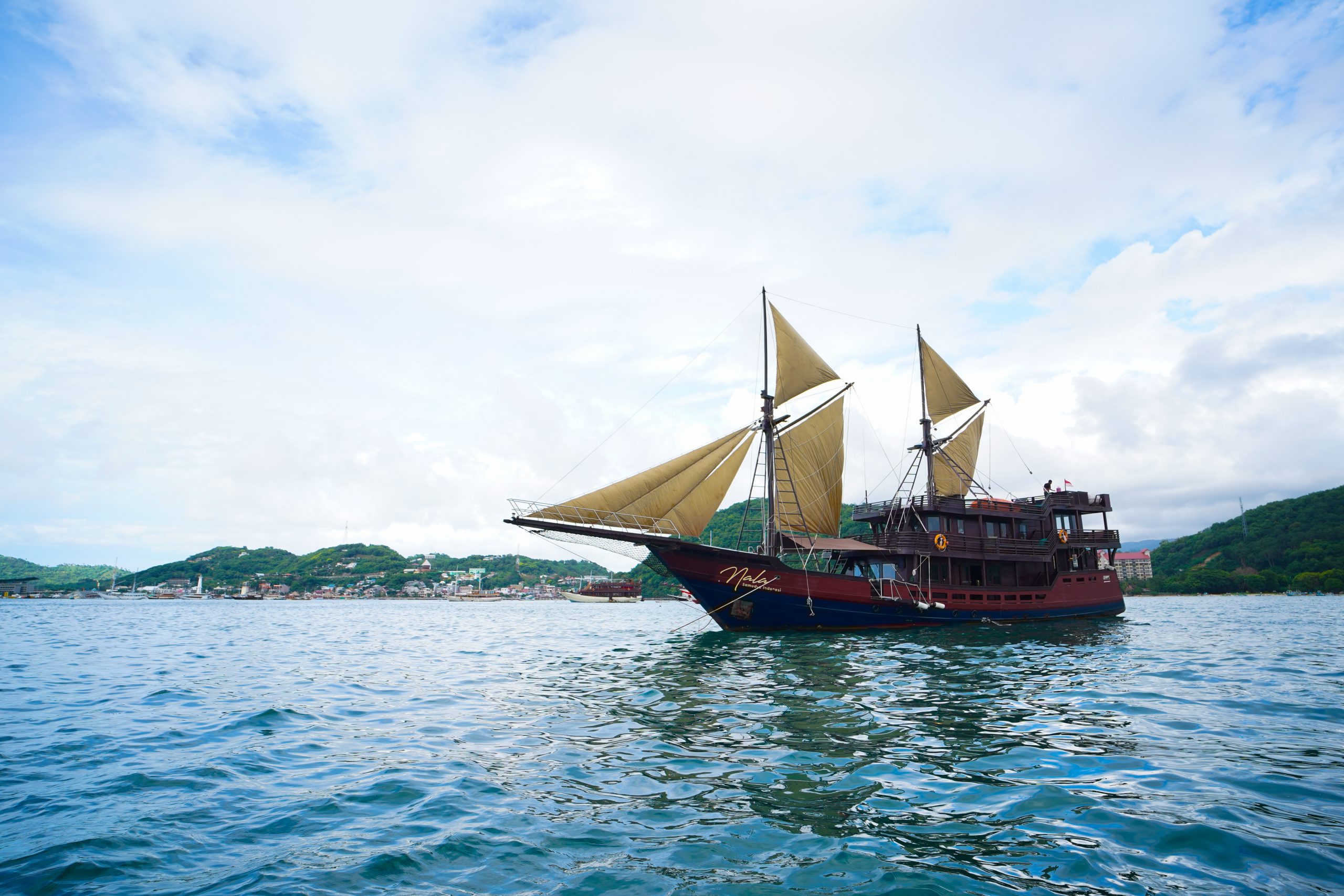 A phinisi under sail in Indonesian waters