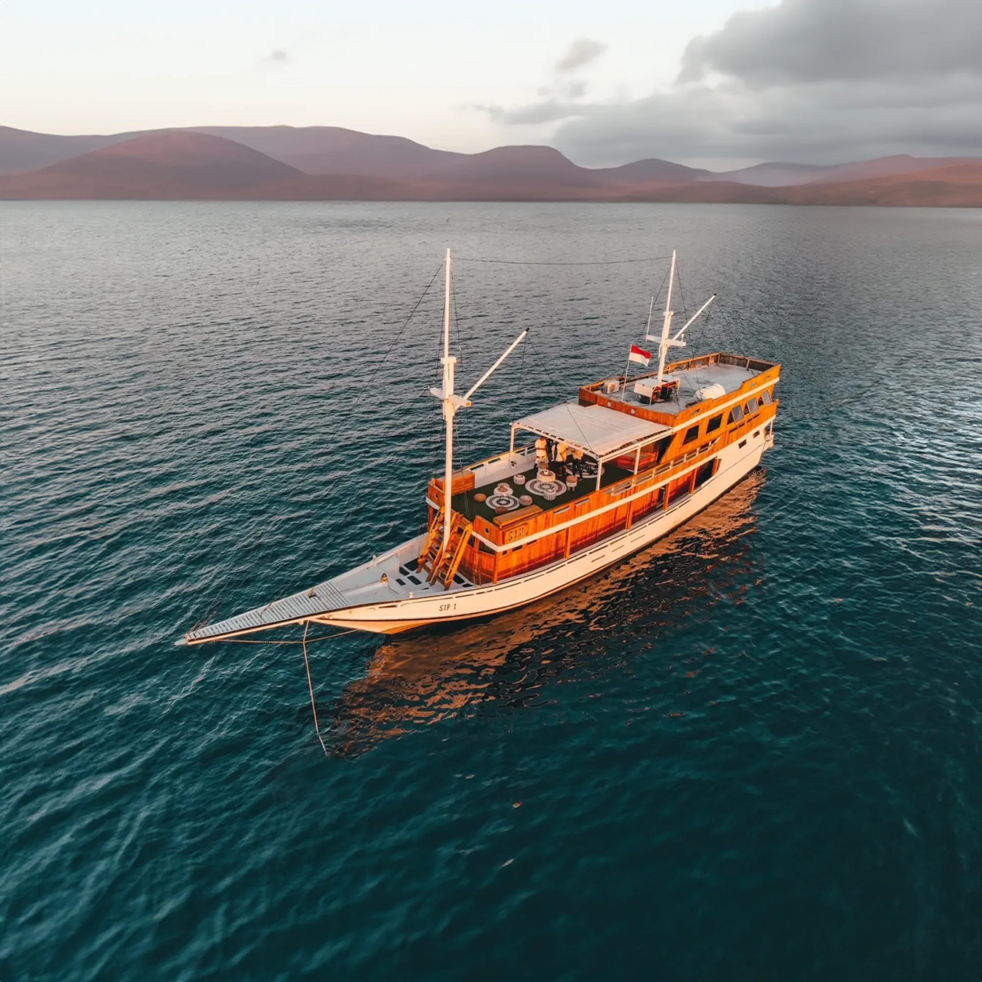 A phinisi under sail in Indonesian waters