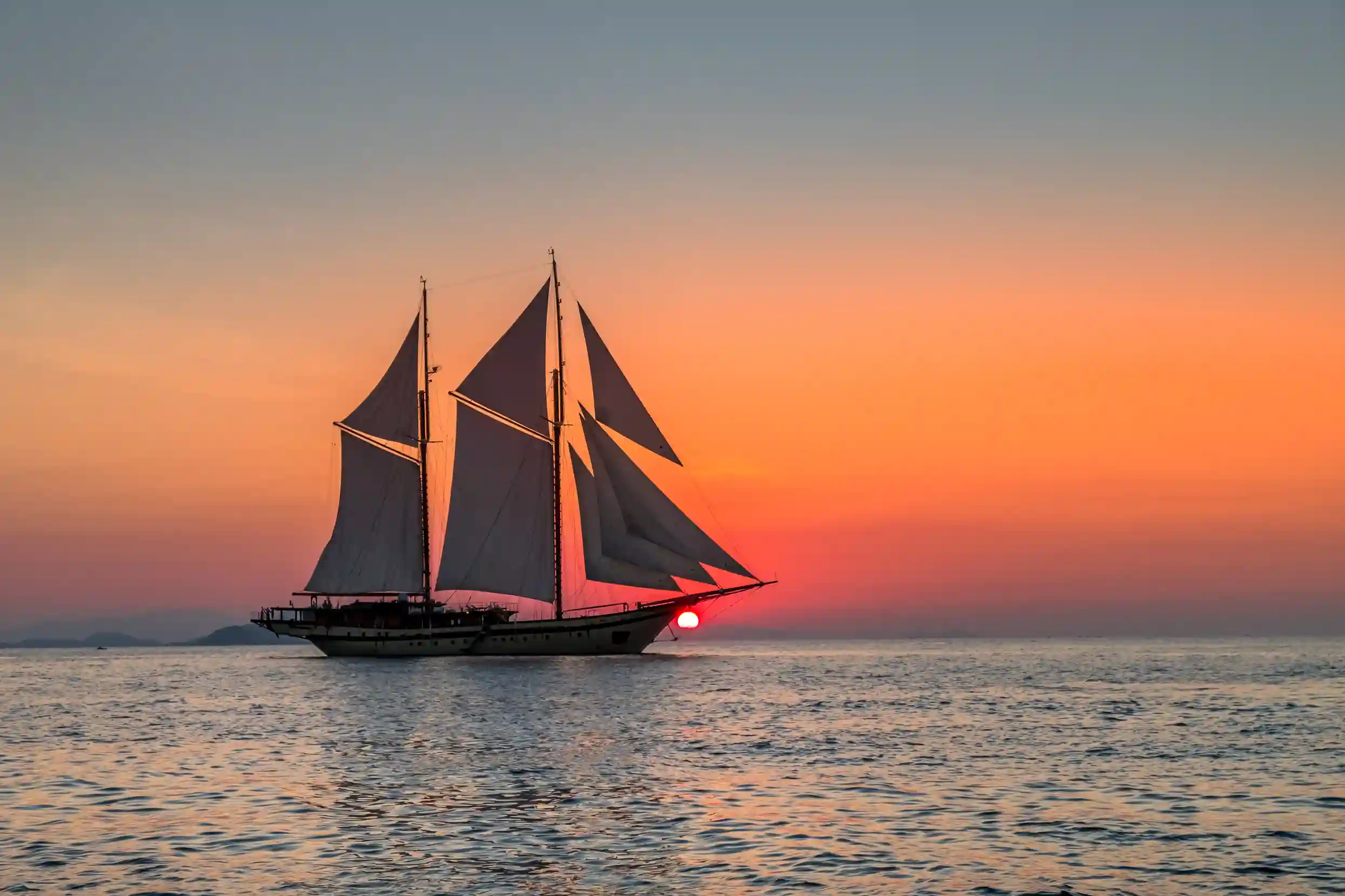 A phinisi under sail in Indonesian waters