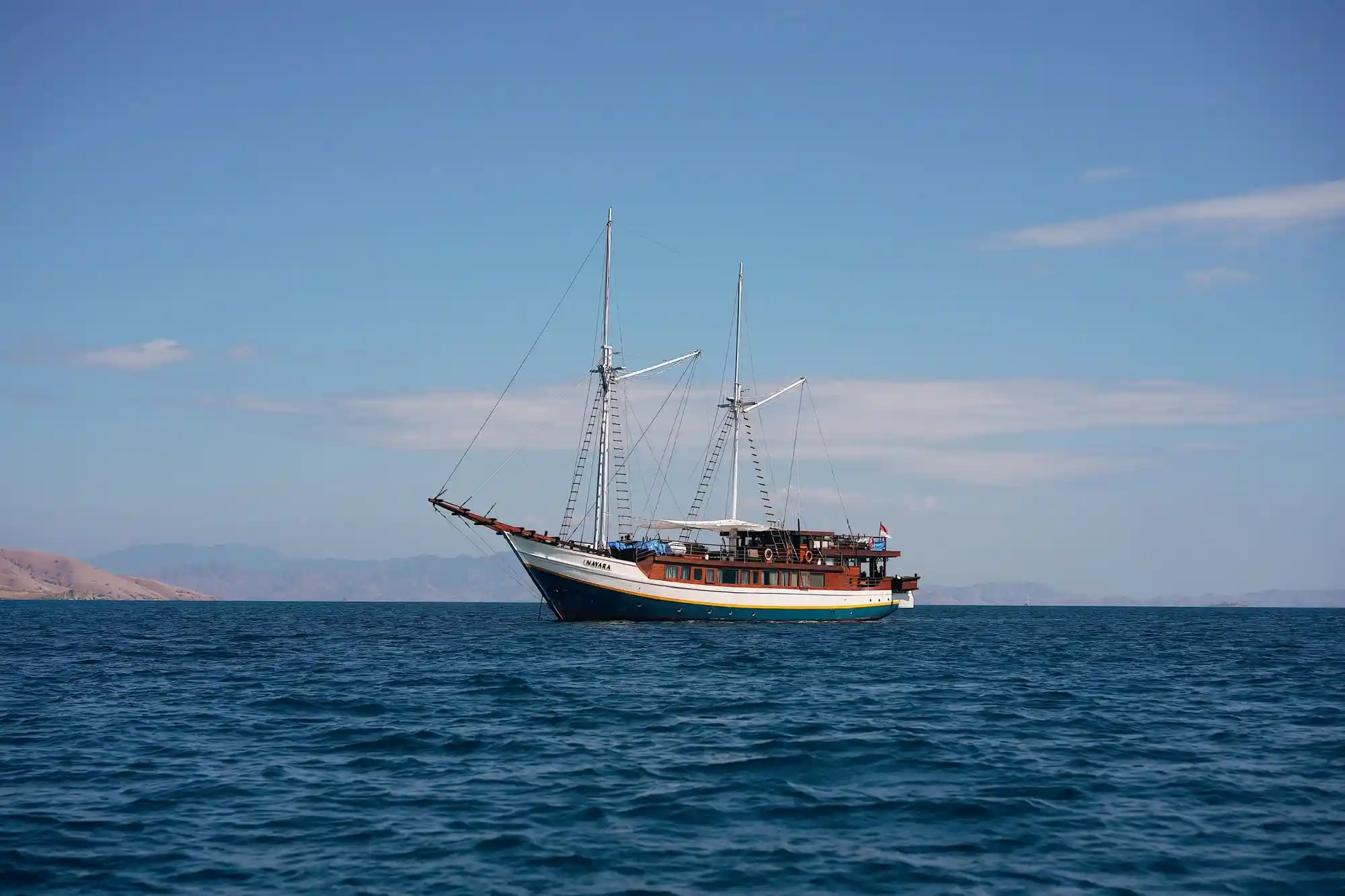 A phinisi under sail in Indonesian waters