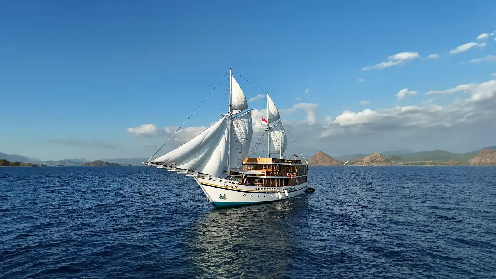 A phinisi under sail in Indonesian waters